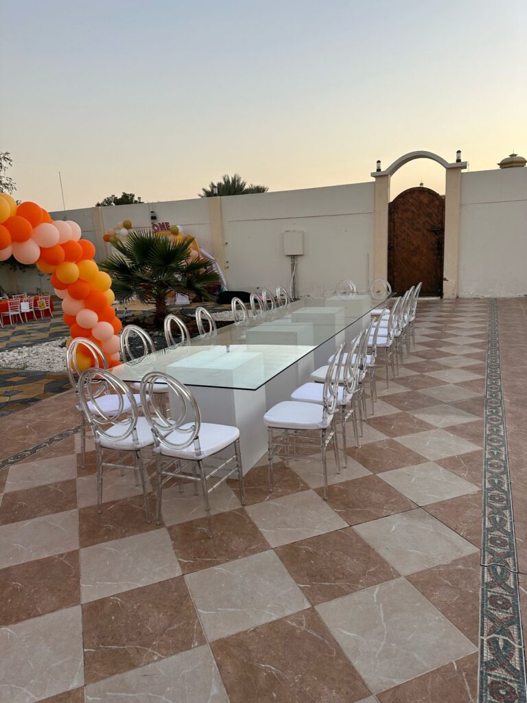 Glass table with Ghost acrylic chairs 10 pax